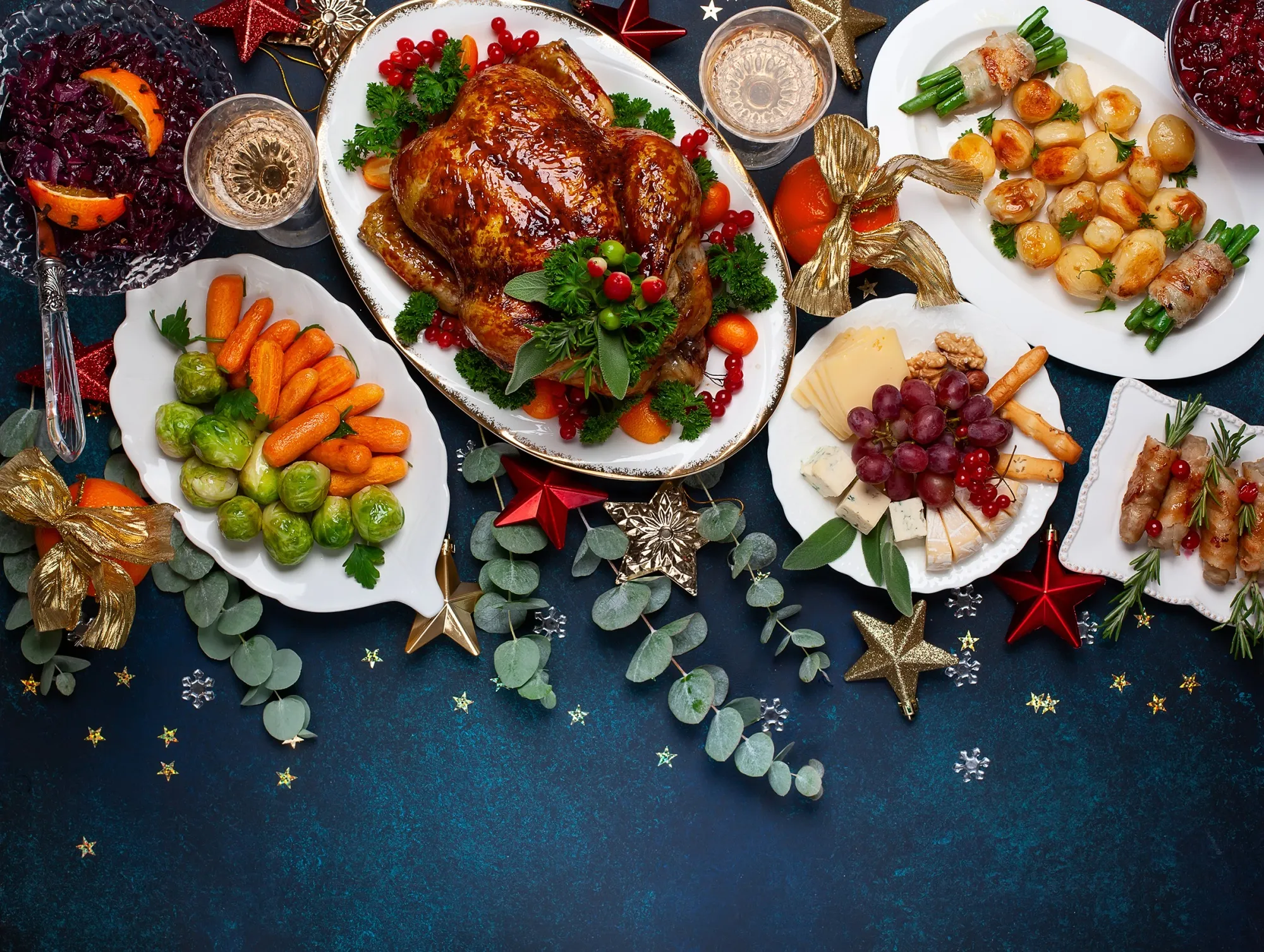 RF Concept of Christmas or New Year dinner with roasted chicken and various vegetables dishes.