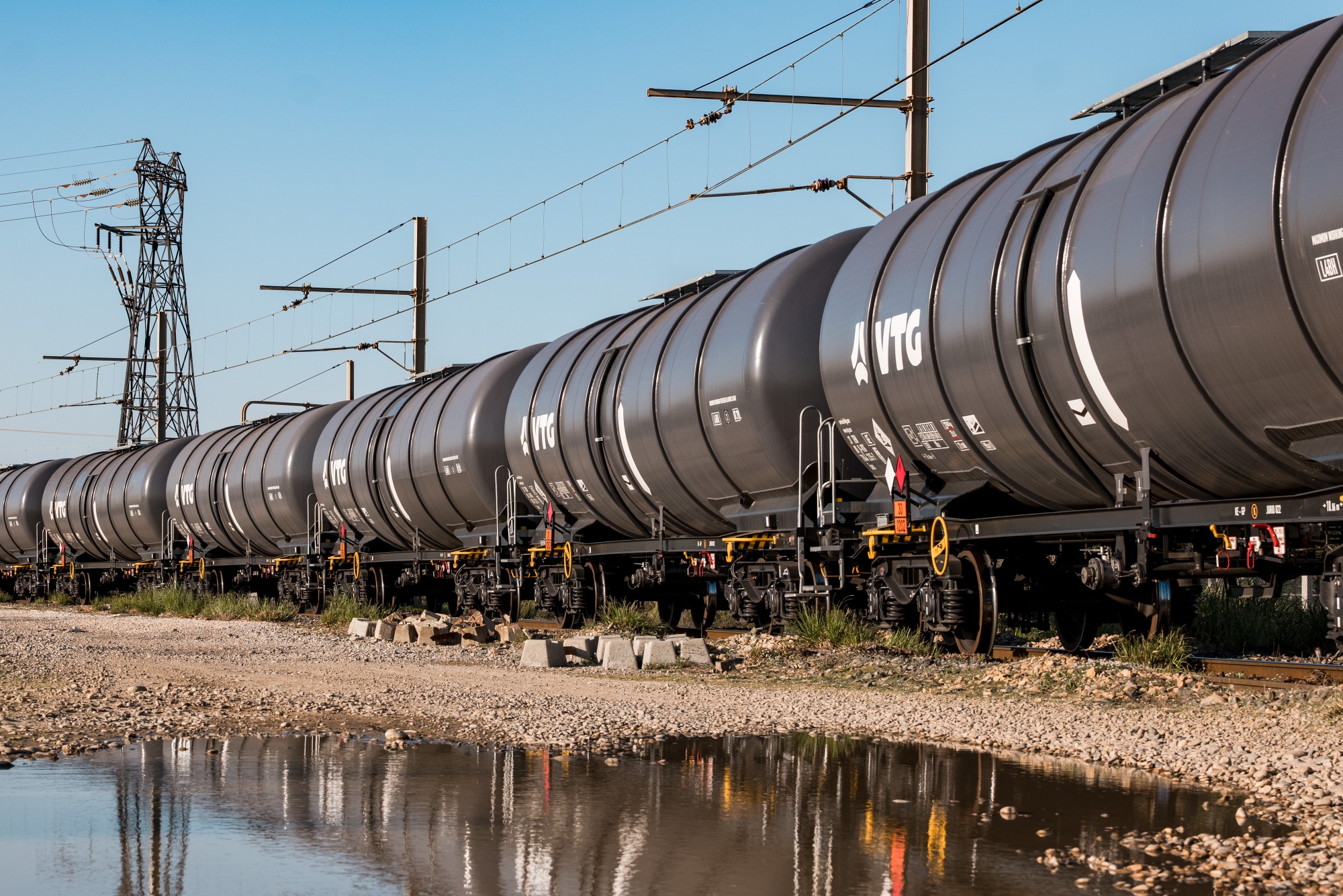 Freight train wagons for oil near oil storage tanks at the Rhone Energies SAS oil refinery in Fos-sur-mer, France, on Friday, March 20, 2026. The European Union's energy chief has told member states to start filling gas storage early in order to avoid supply competition over the summer. Photographer: Jeremy Suyker/Bloomberg