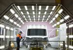 A worker checks the body shell of a Ford Transit van on the production line at the Ford Sollers production plant in Elabuga, Russia in 2020.&nbsp;