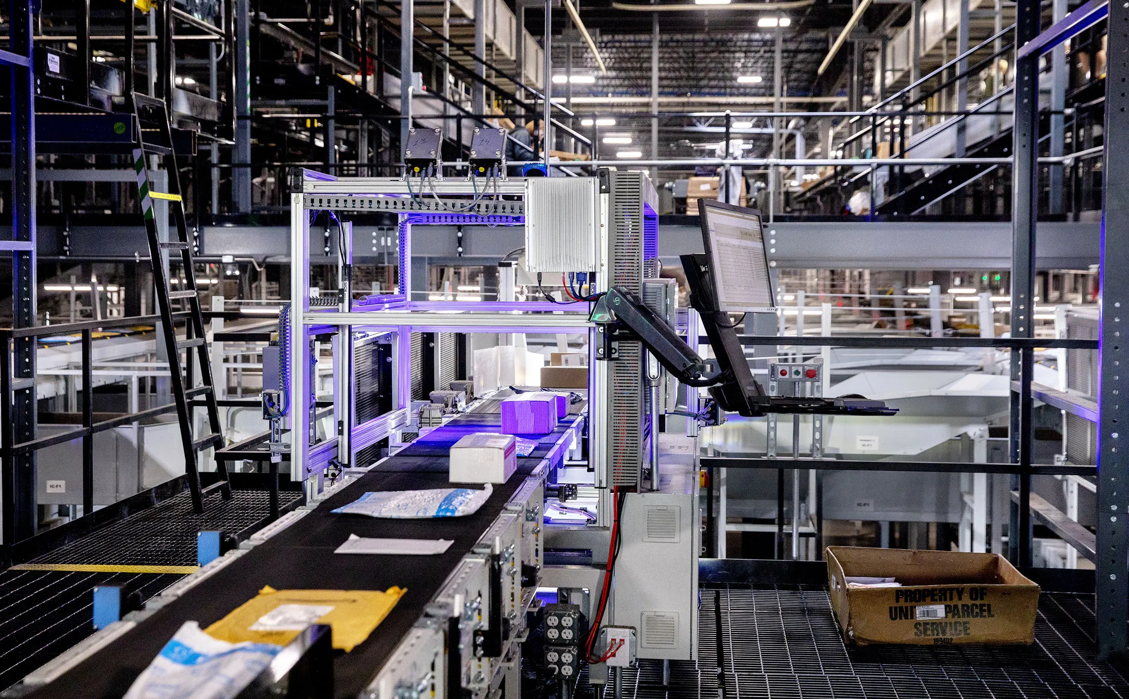 Automated machines move and scan packages at a UPS facility in Salt Lake City.
