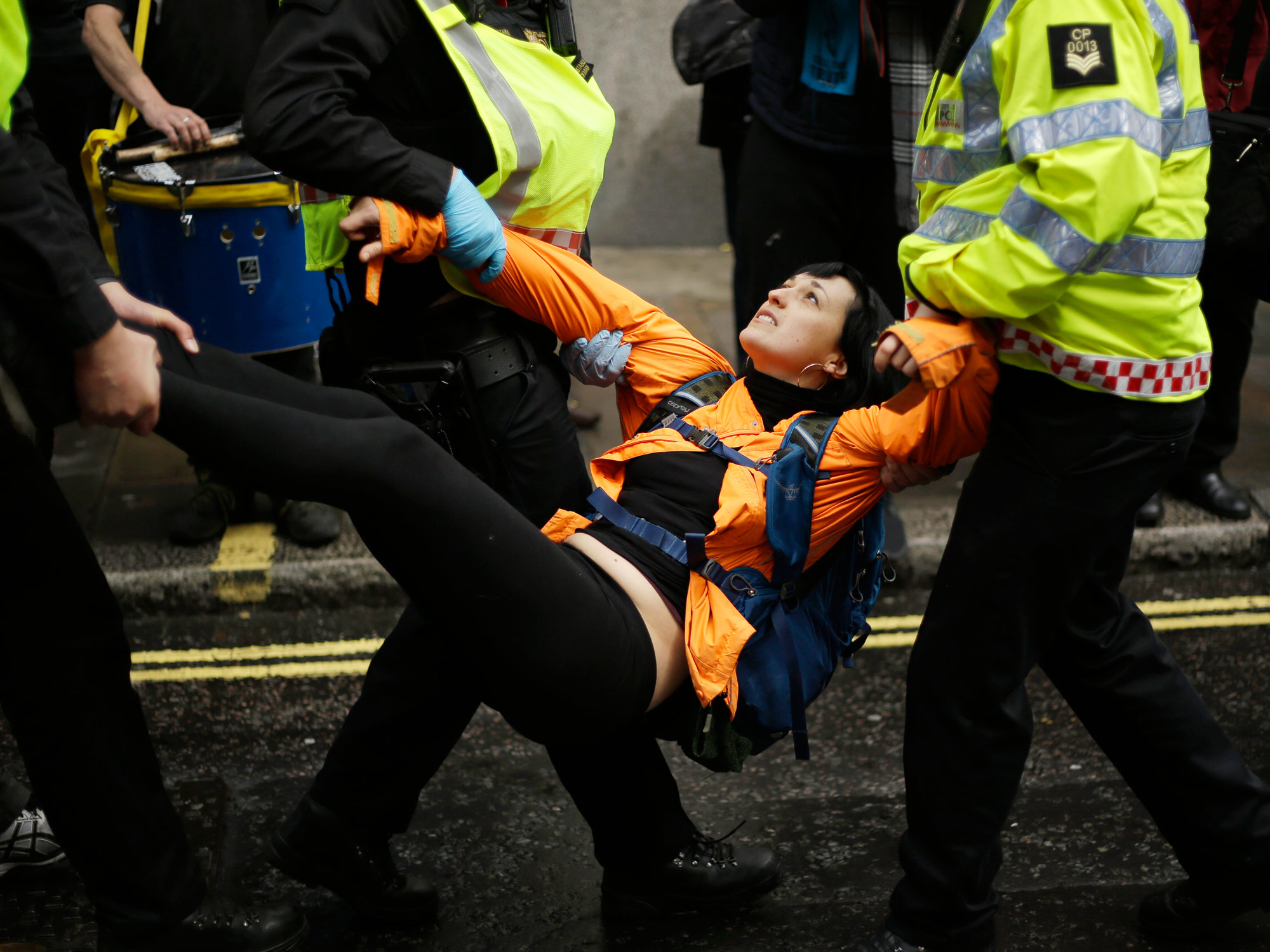 Police remove an Extinction Rebellion activist outside the Goldman Sachs building in London on April 25.