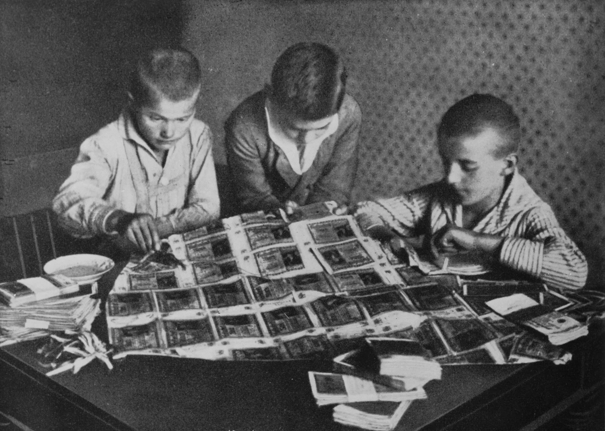 Children play with virtually worthless paper money during Germany’s hyperinflation in 1923.