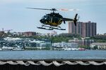 A Bell 407 helicopter arrives at the Blade Lounge West landing area in New York.