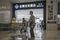 A customer pushes a loaded shopping cart near the entrance. Photographer: Qilai Shen/Bloomberg