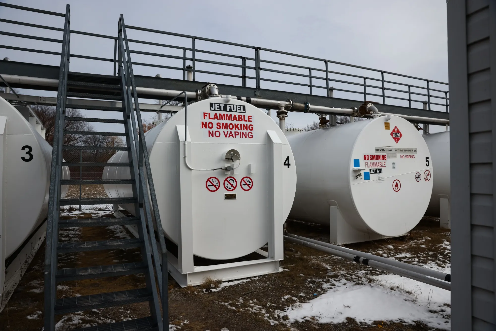 Jet fuel tanks at Toronto Island Airport in Toronto, Ontario, Canada, on Wednesday, March 18, 2026. Gasoline, diesel and jet fuel prices have jumped, as the conflict between the US, Israel and Iran chokes off oil shipments through the Strait of Hormuz.