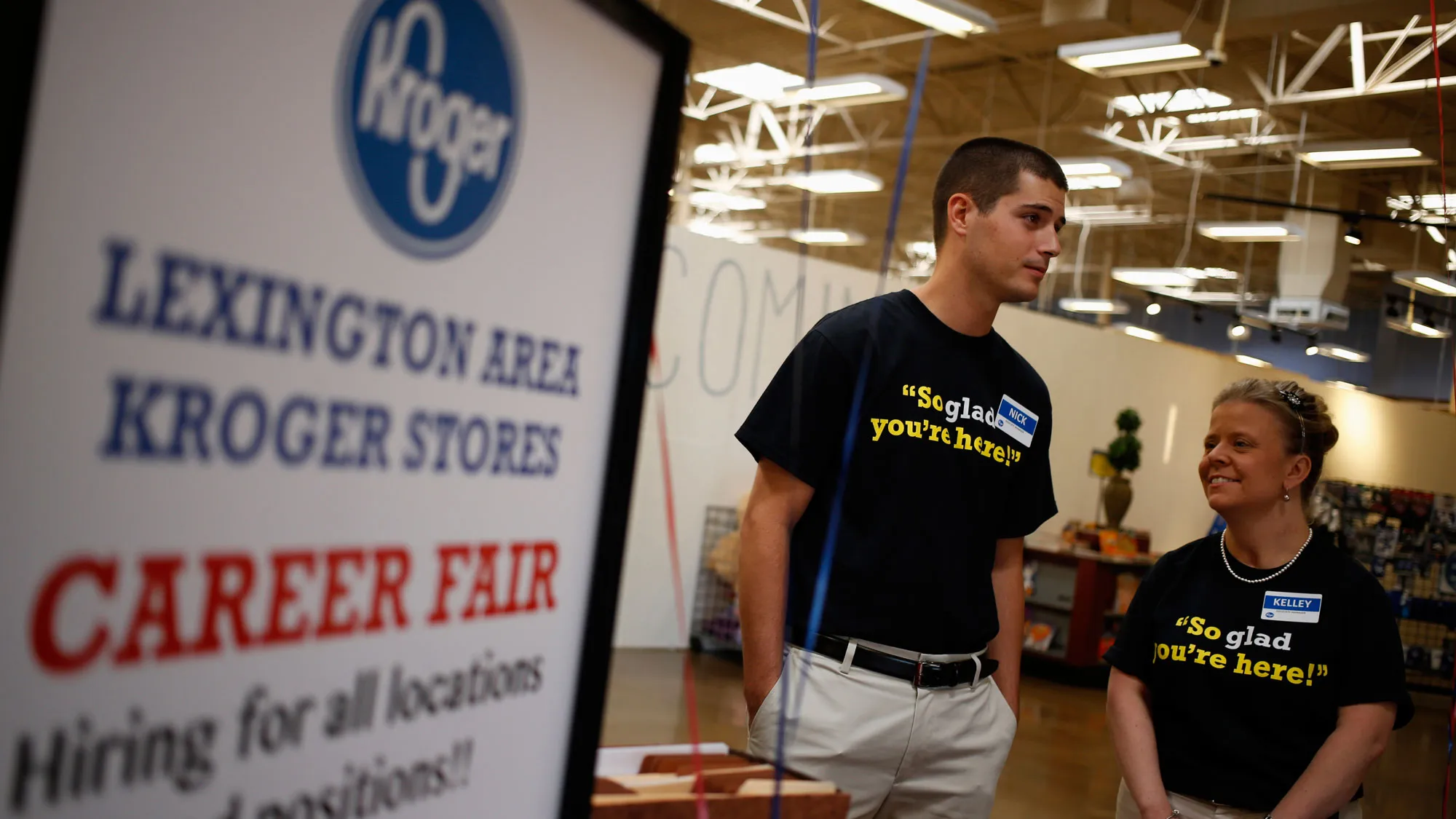 Employees wait to greet job seekers during a Kroger Co. Hiring Fair at one of the company's grocery stores in Lexington, Kentucky, U.S., on Wednesday, Oct. 8, 2014.
