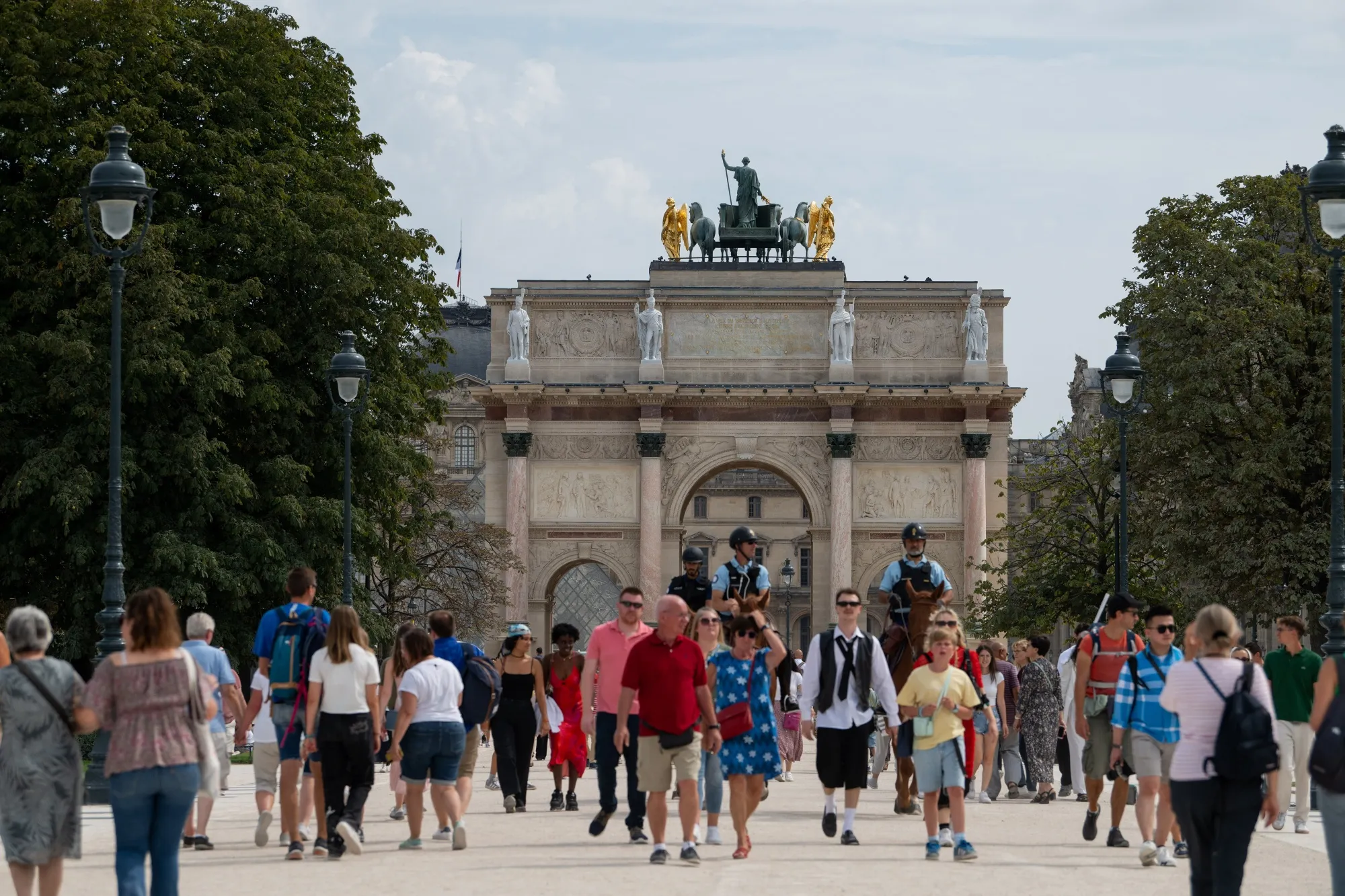 Tourists in the Tuileries garden in Paris.