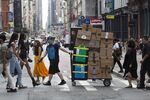 A worker delivering Amazon packages in New York.