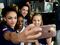 Laurie Hernandez takes a photo with Simone Biles, Aly Raisman and Madison Kocian on the Today Show set at Copacabana Beach in Rio de Janeiro, on August 18, 2016.