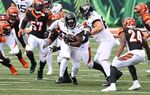 The Jacksonville Jaguars run with the ball in Cincinnati, Ohio.
