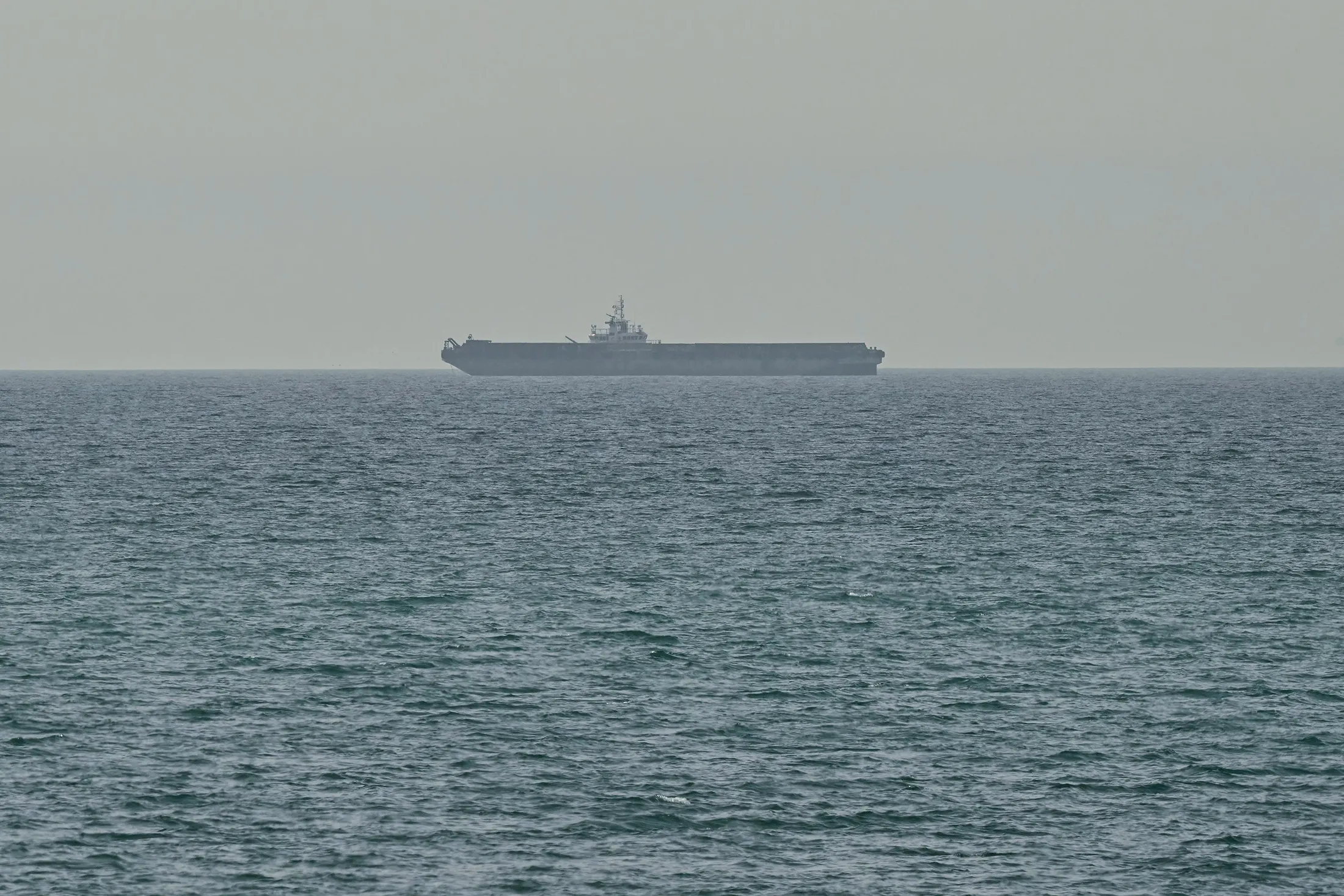 A ship is seen off the coast of Ras al-Khaimah, the day after the failure of US-Iran peace talks on April 13.