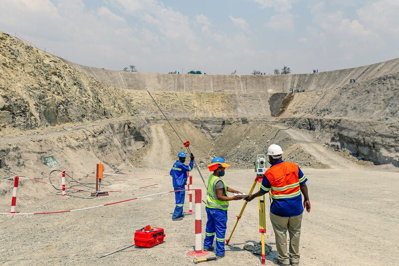 Workers survey at the Great&nbsp;Dyke&nbsp;Investments Ltd. Darwendale platinum mine project, near Harare, Zimbabwe.