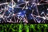 An attendee takes a photograph of the stage prior to the Nvidia Corp. event at the 2019 Consumer Electronics Show (CES) in Las Vegas, Nevada, U.S., on Sunday, Jan. 6, 2019. CES showcases more than 4,500 exhibiting companies, including manufacturers, developers and suppliers of consumer technology hardware, content, technology delivery systems and more.
