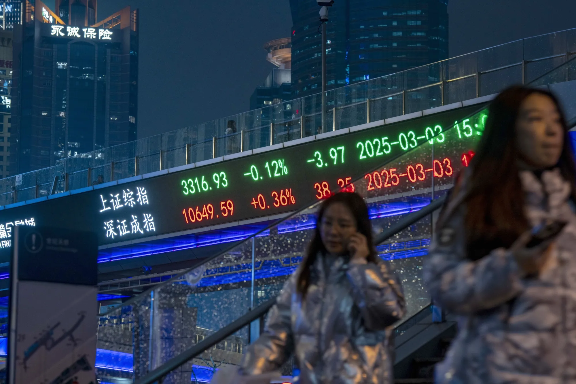 Stock figures displayed in Pudong's Lujiazui Financial District in Shanghai.
