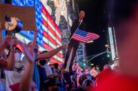 People celebrate as Joe Biden is declared the winner of the election, in New York, on Nov. 7.