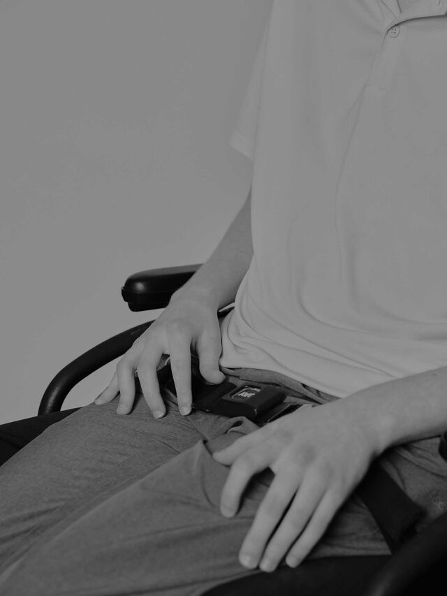 Photo of Michael Brewer's hands while sitting in his wheelchair