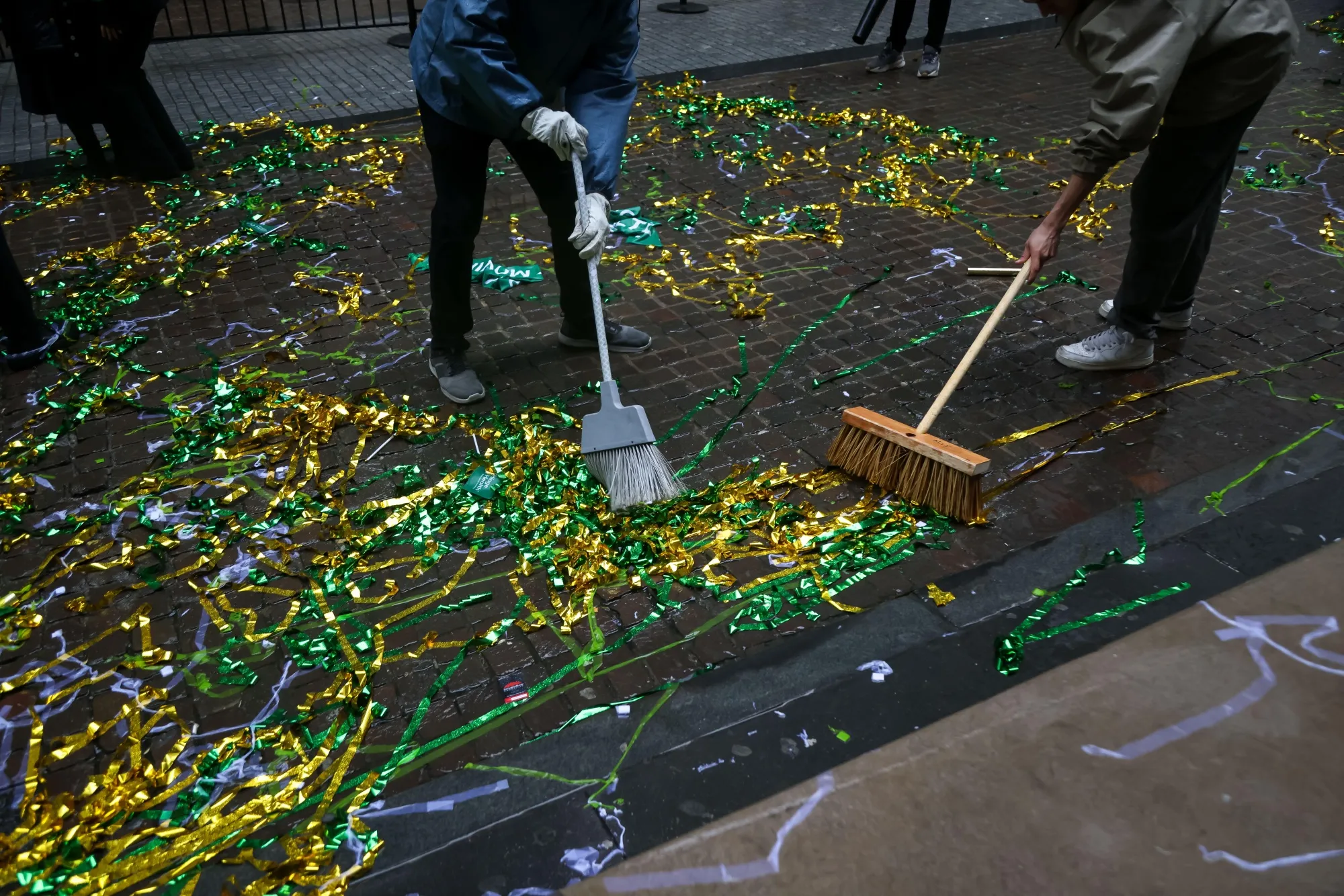 Workers clean up confetti during an initial public offering (IPO) outside the New York Stock Exchange (NYSE) in New York.
