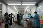 Members of the public visit a Covid-19 polymerase chain reaction (PCR) testing site in the Akihabara district of Tokyo, Japan