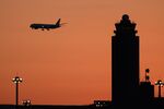 A Japan Airlines aircraft approaches to land at Narita Airport.