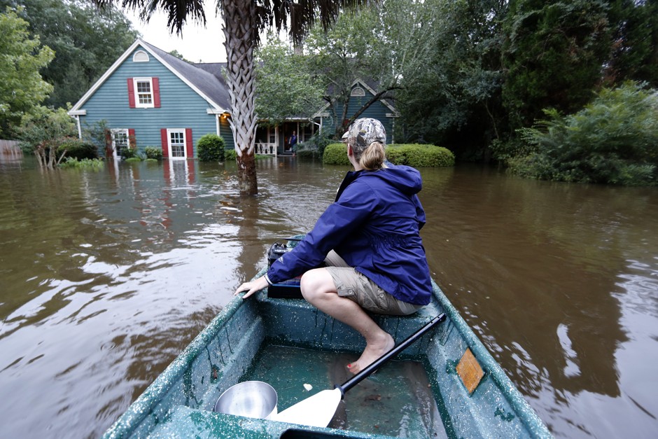 A resident checking in on neighbors after a flood in Summerville, South Carolina, on October 5, 2015.