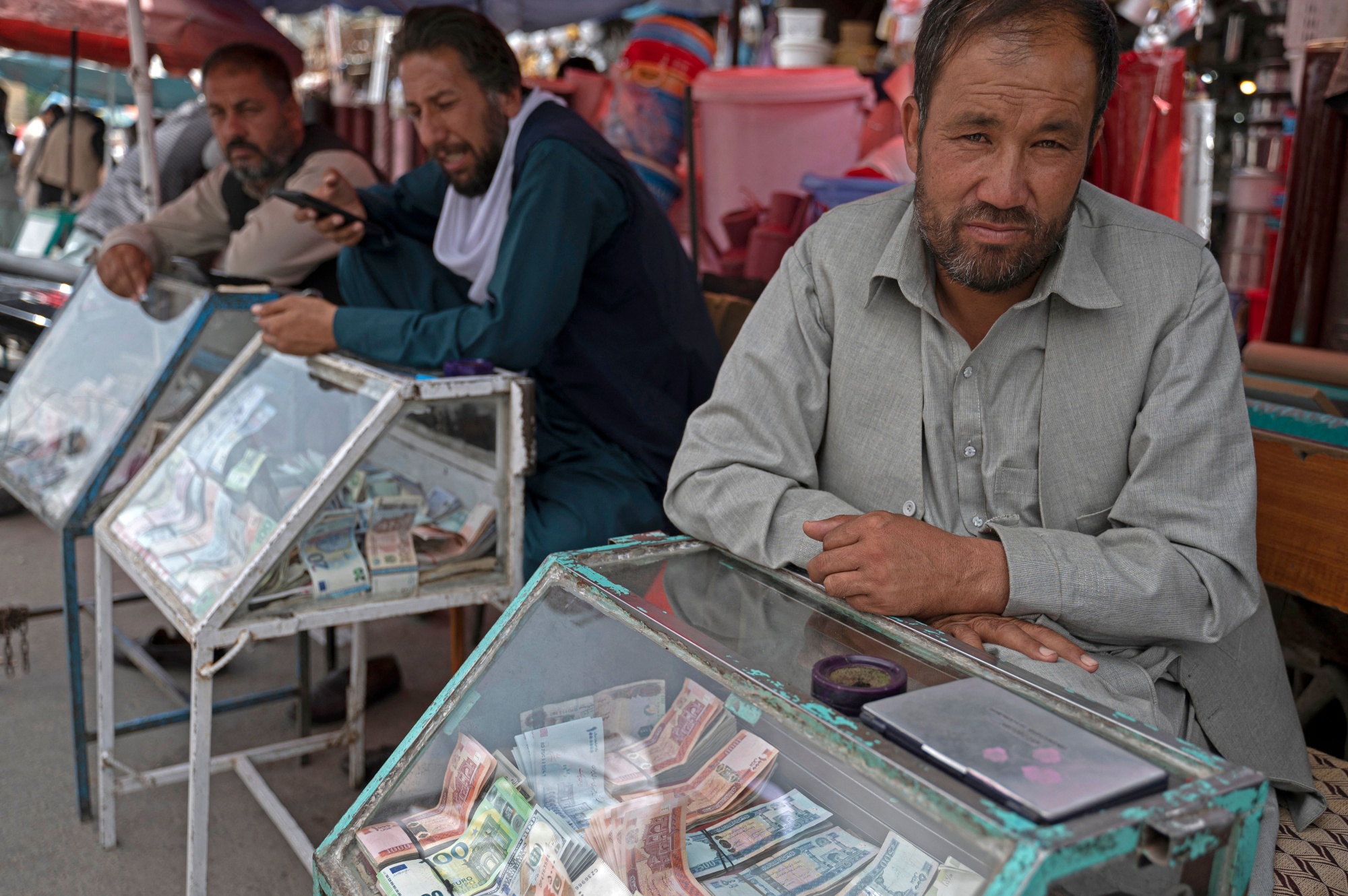 Afghan money changers wait for customers&nbsp;in Kabul.