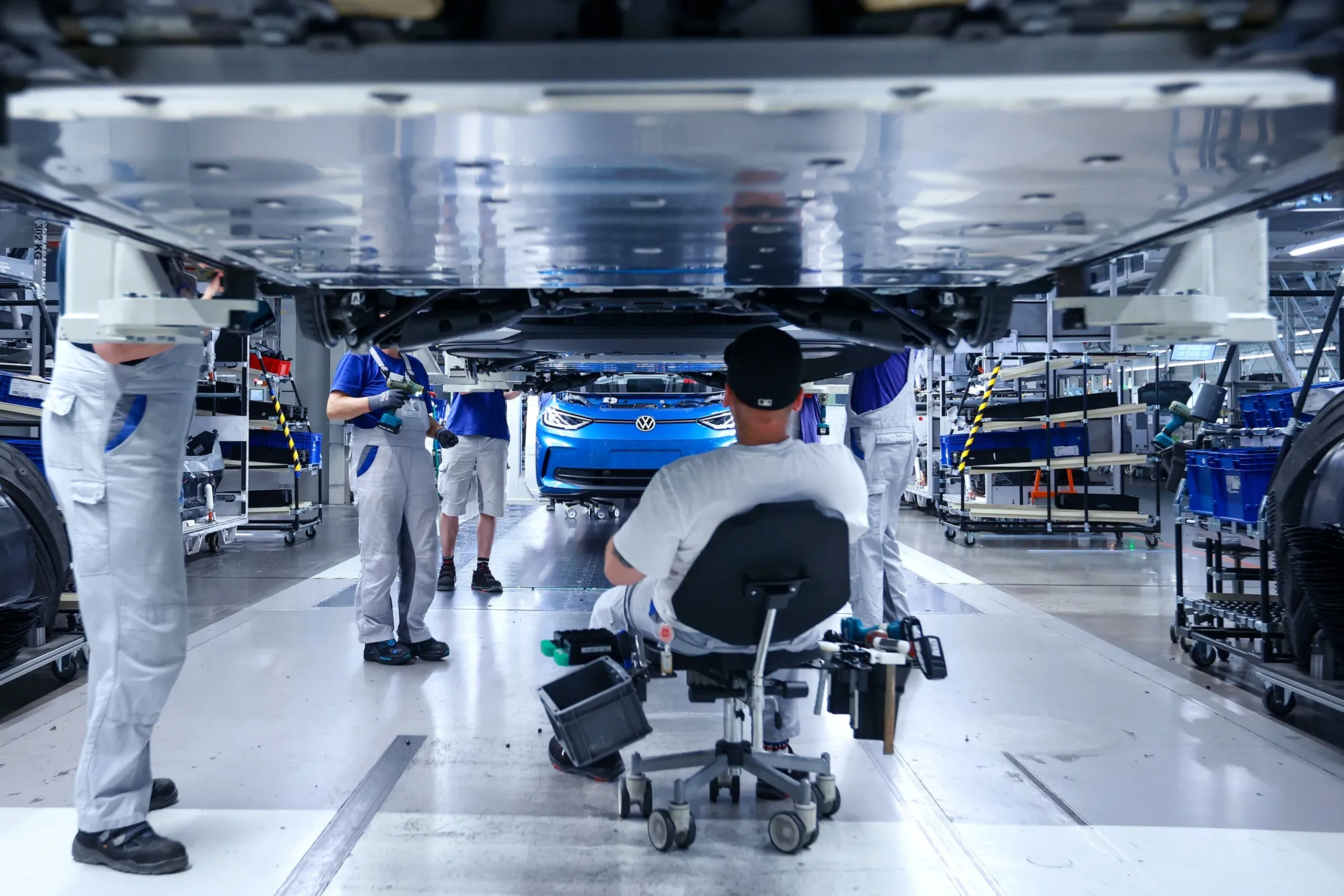Employees work on the assembly line at the Volkswagen Sachsen GmbH plant in Zwickau, Germany.
