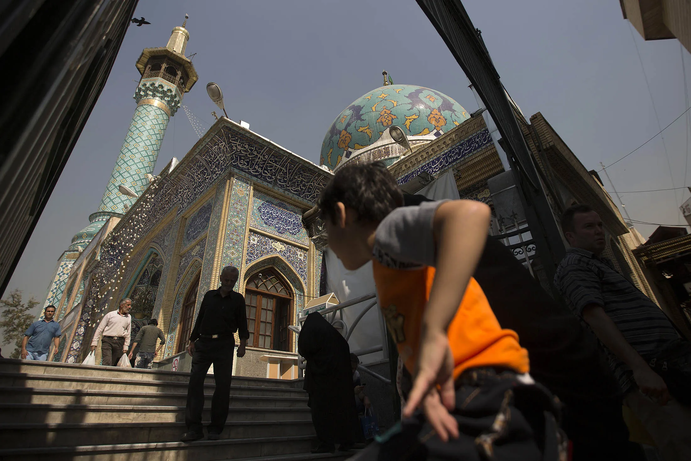Visitors approach the Emamzade mosque in Tehran.
