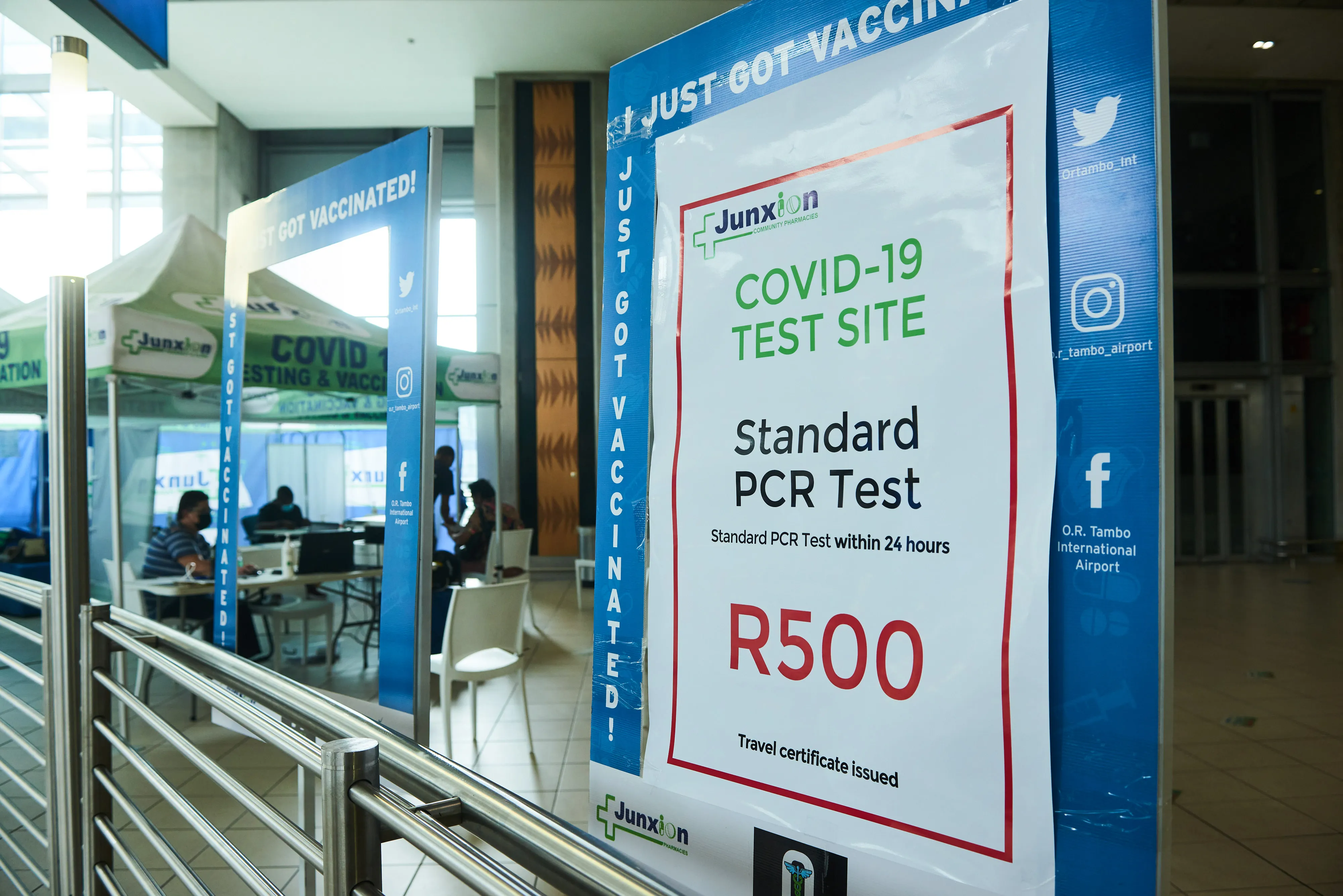A sign for Covid-19 PCR testing inside the departures terminal at O.R. Tambo International Airport in Johannesburg, South Africa.