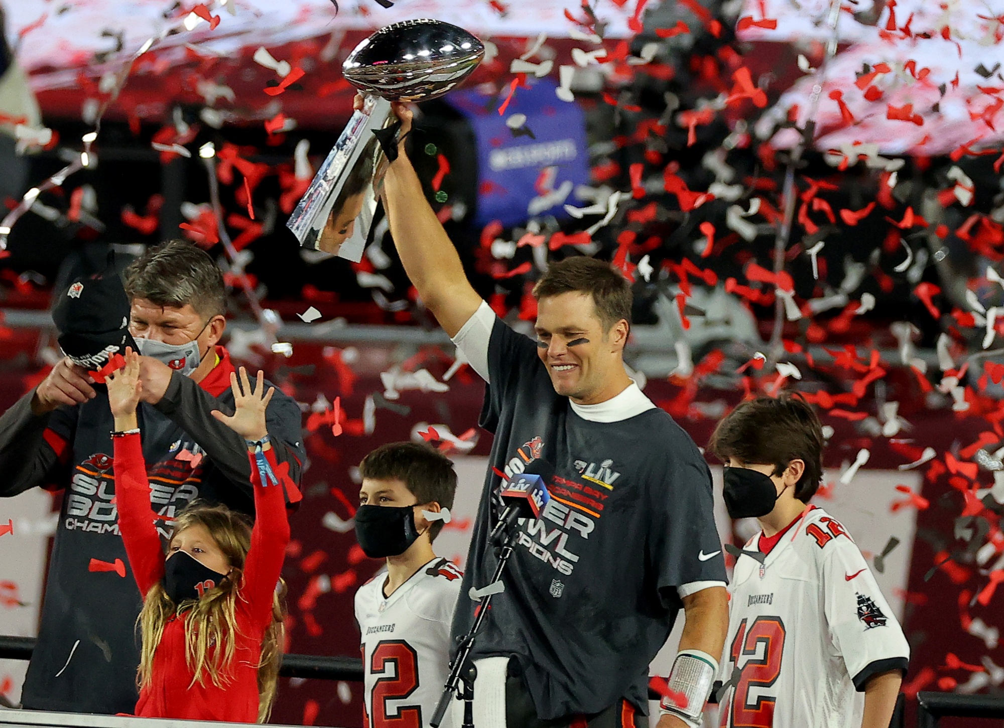 Tom Brady #12 of the Tampa Bay Buccaneers celebrates with the Lombardi Trophy after defeating the Kansas City Chiefs in Super Bowl LV at Raymond James Stadium in Tampa, Florida, on Feb. 7.
