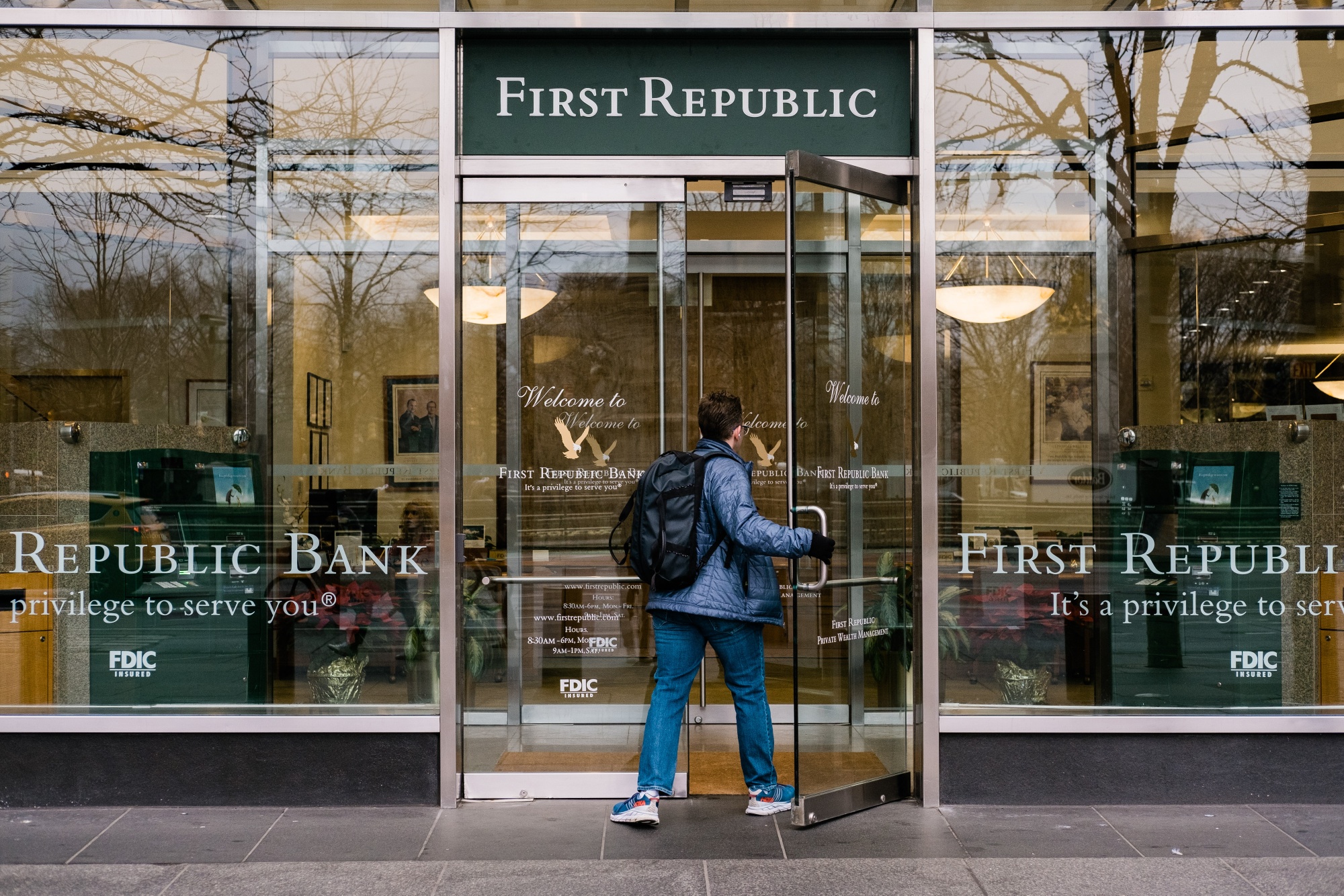 A pedestrian enters a First Republic Bank branch in New York.