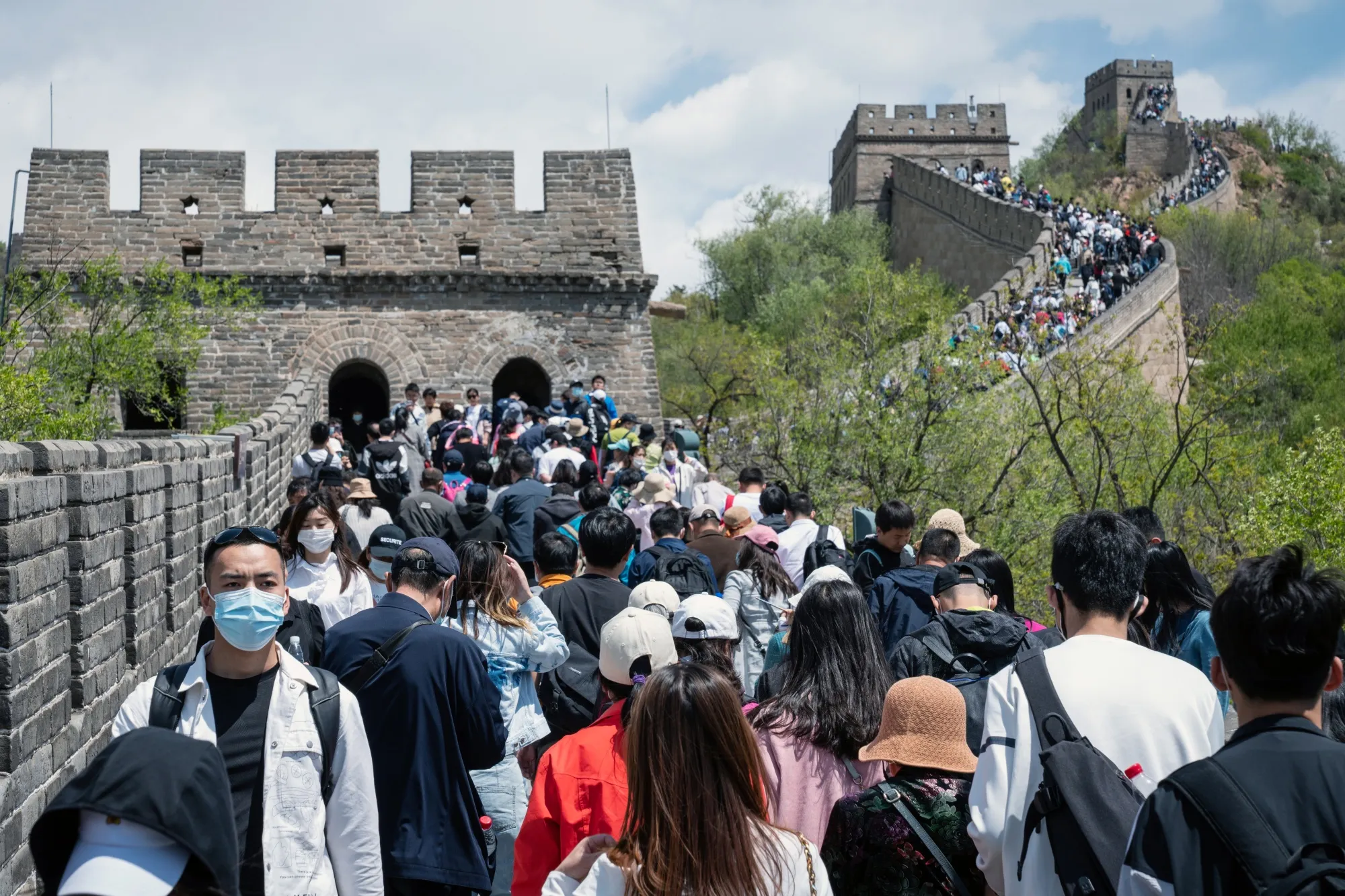 Visitors walk along the Badaling section of the Great Wall in Beijing, China.
