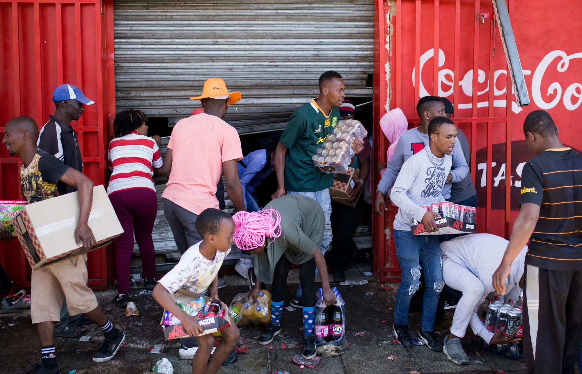 People take items from a store&nbsp;during a riot in Johannesburg on Sept. 2.