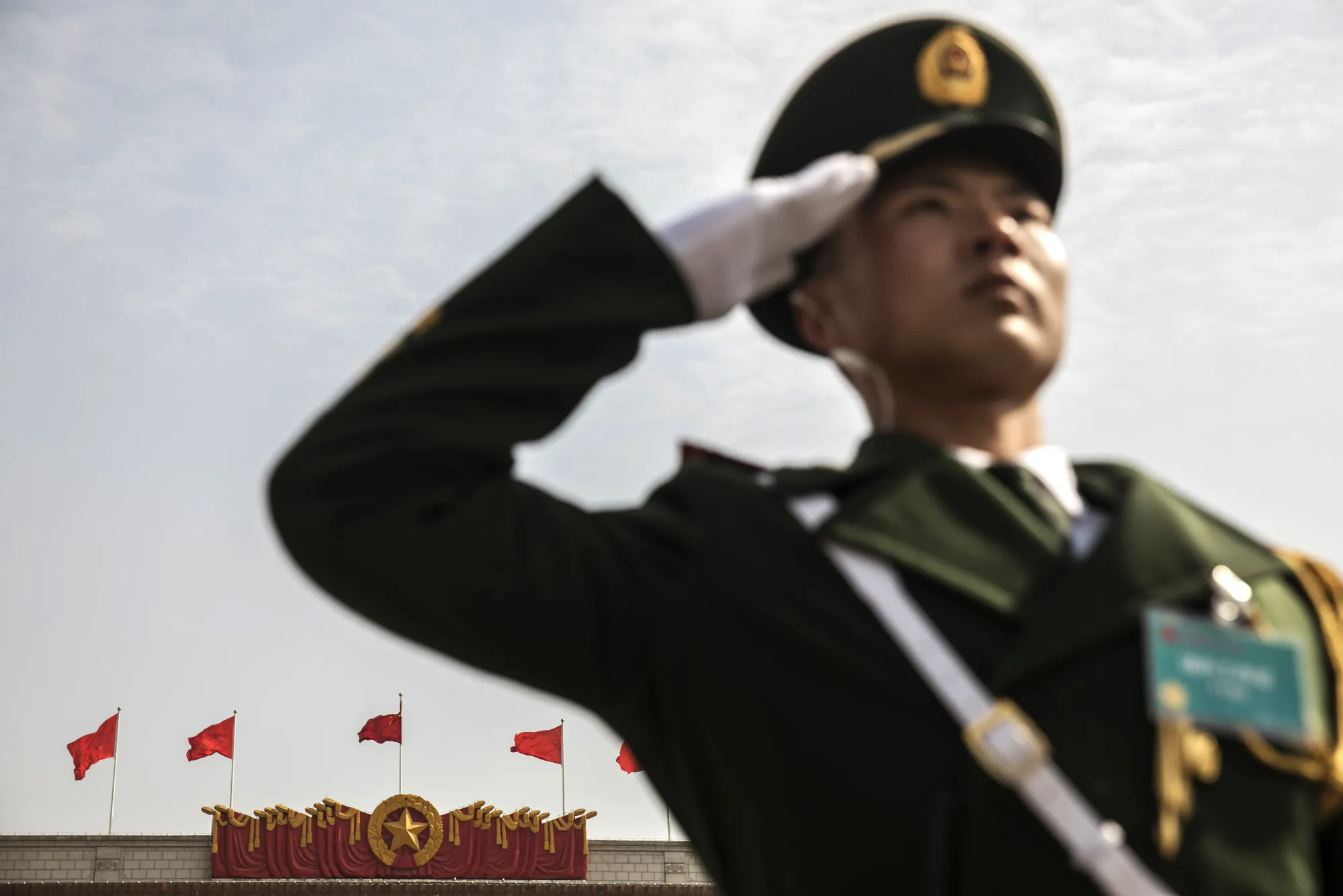 A member of the Chinese People's Armed Police salutes in Tiananmen Square.&nbsp;