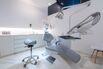 Facilities of a modern dental clinic. Dental practice room interior with chair, lamp, screen and stomatology tools