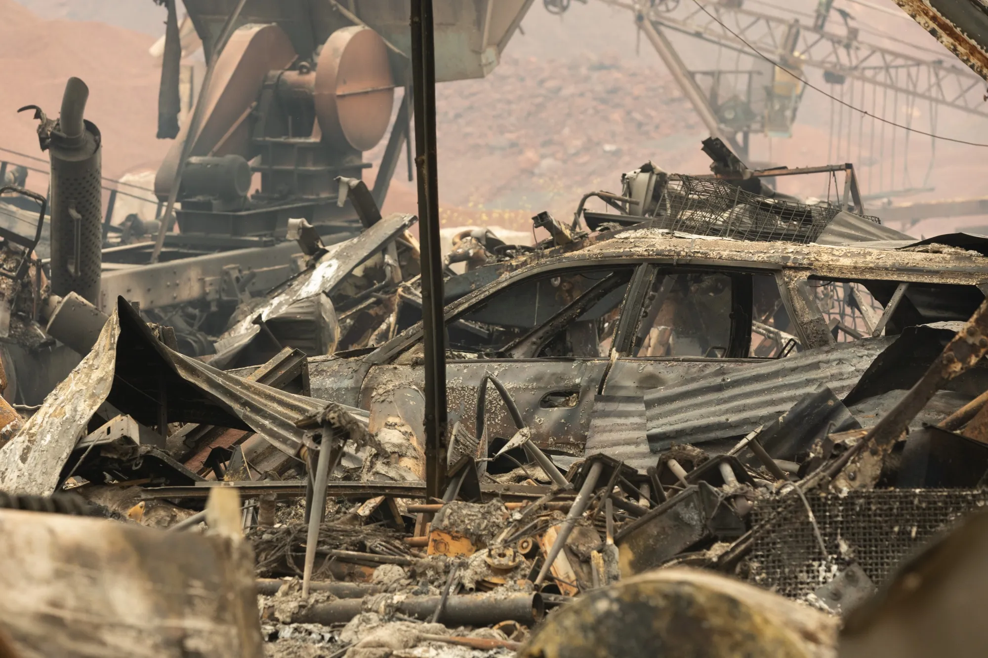 Burned vehicles and property following the Park Fire near Paynes Creek, California, on July 27.