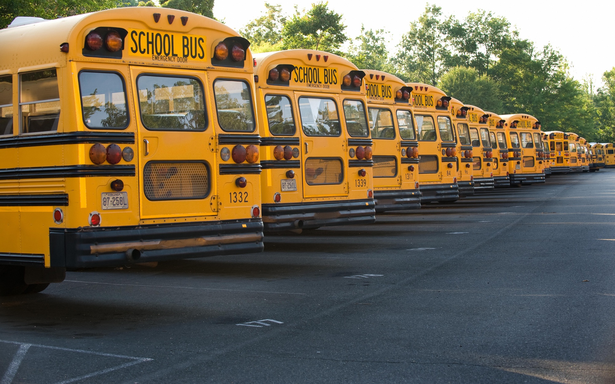 TO GO WITH AFP STORY COMMODITIES-OIL-ENERGY by Virgine Montet Some of the hundreds of school buses Fairfax County uses, wait in a parking lot on June 24, 2008 in Fairfax, Virginia for the next school day and to transport school children. US school children will face longer walks to the bus stop, longer days and shorter weeks at school, while university students are pushed to take online courses, all thanks to relentless spiraling fuel prices. AFP PHOTO/Paul J. Richards (Photo credit should read PAUL J. RICHARDS/AFP via Getty Images) Photographer: AFP/AFP