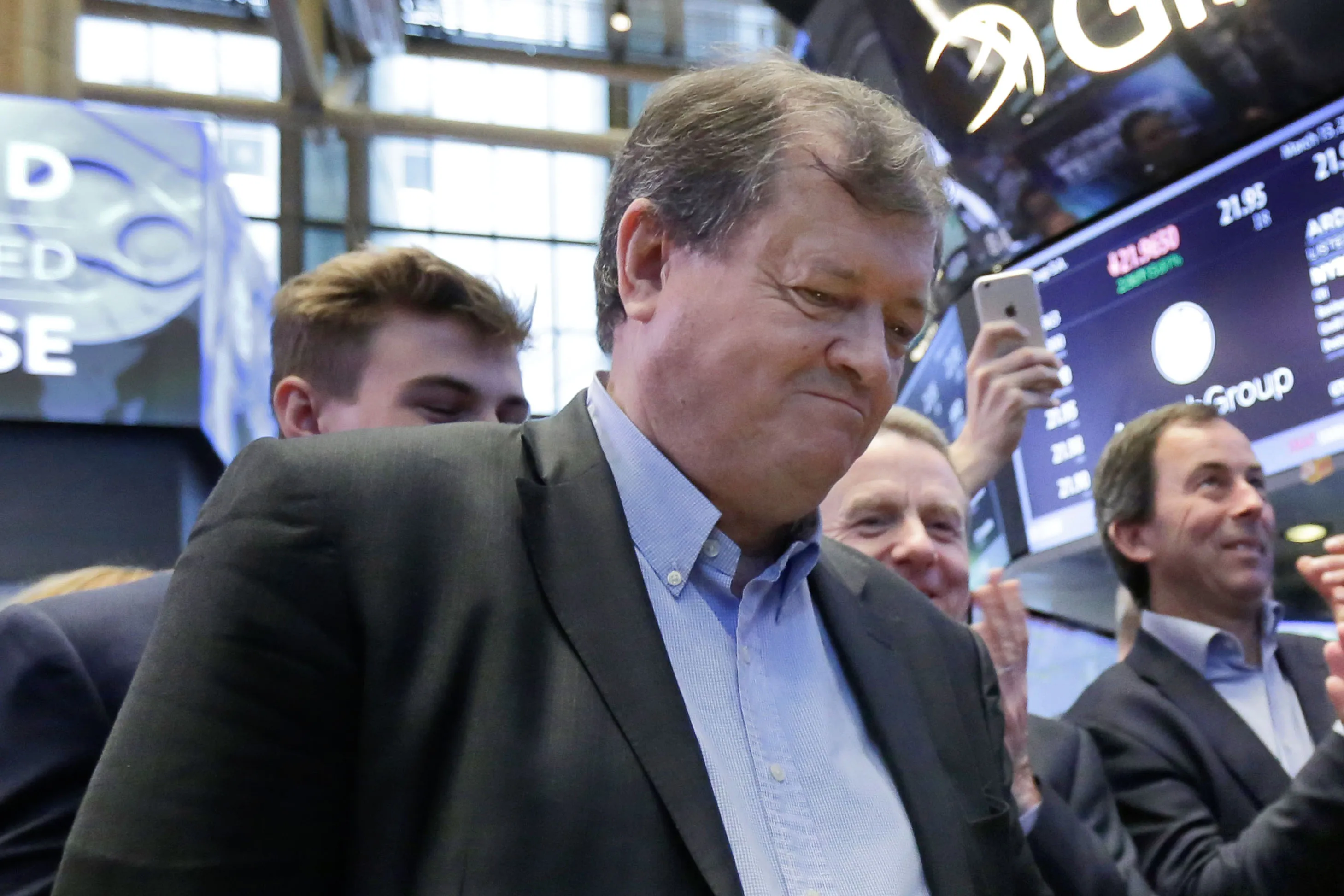 Ardagh Group Chairman Paul Coulson, left, is applauded as he rings a ceremonial bell to mark the IPO of his company, on the floor of the New York Stock Exchange, Wednesday, March 15, 2017. (AP Photo/Richard Drew)