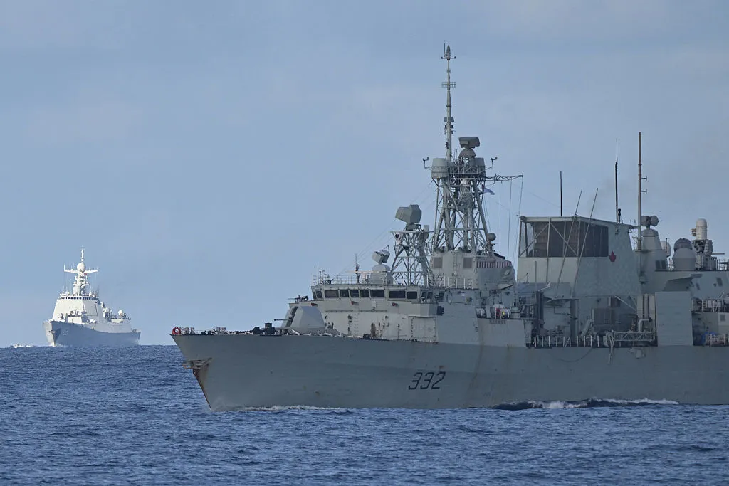 A Chinese PLA Navy ship&nbsp;shadows the Royal Canadian Navy HMCS Ville de Quebec, during&nbsp;maritime cooperative activity with the Philippines, in disputed waters of the South China Sea.