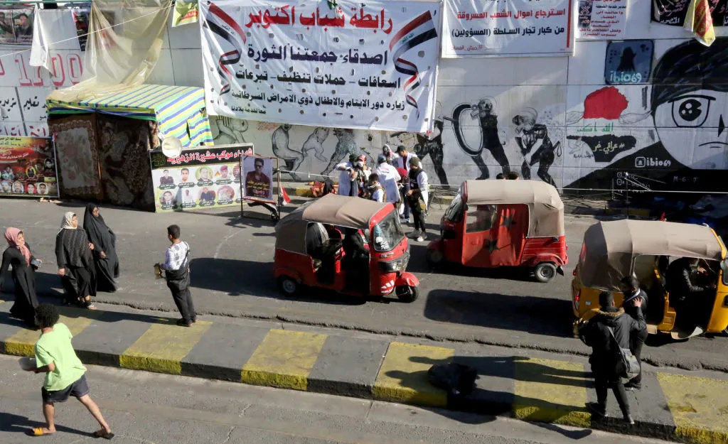 Iraqi protesters gather at Baghdad's Tahrir Square as demonstrations continue on Dec. 28.