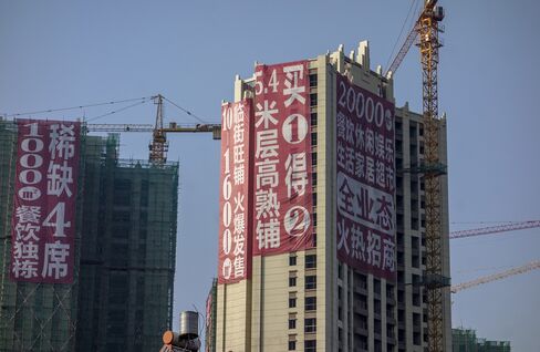 Huge promotion advertisement hangs on a real estate project