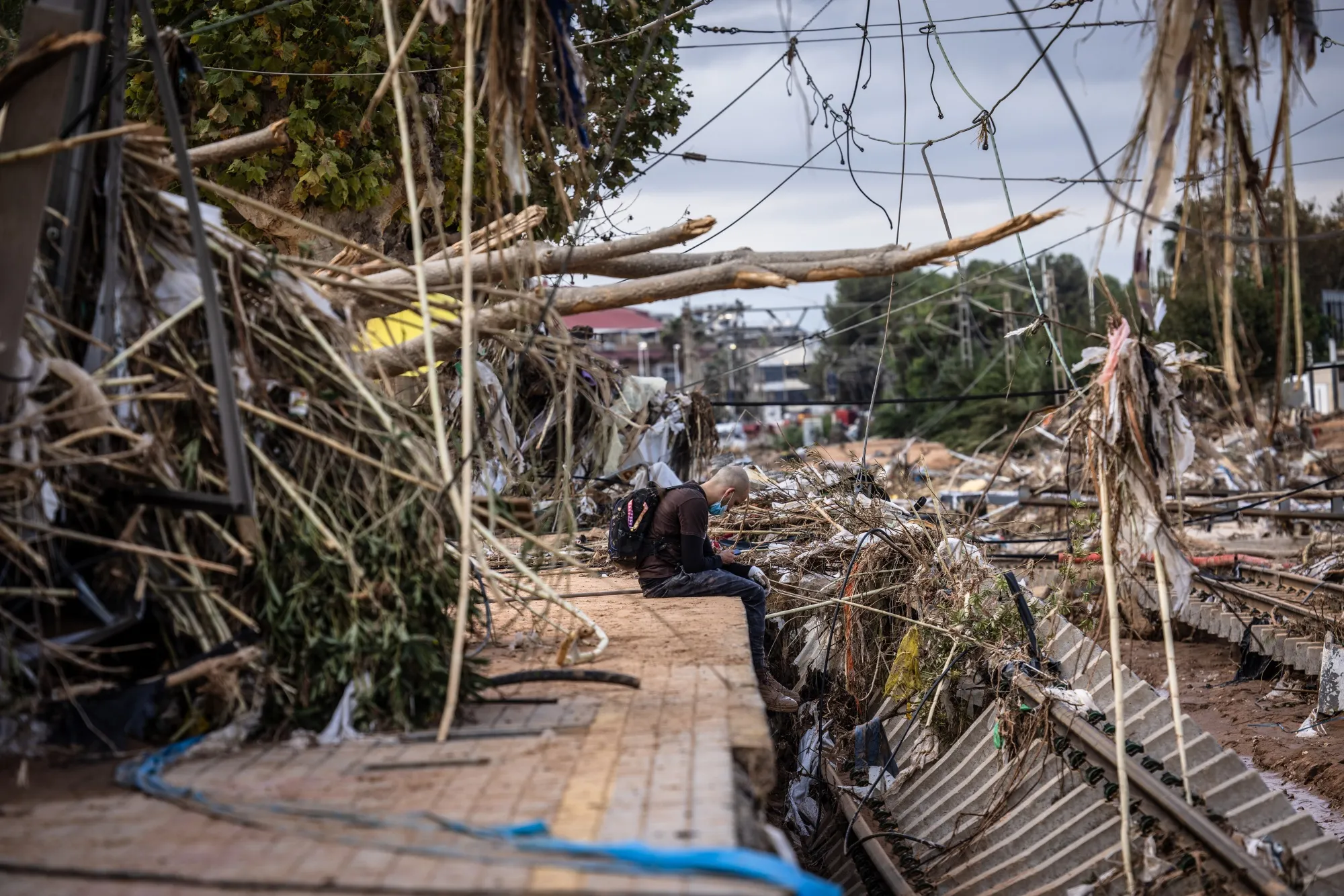 Flood debris near destroyed train tracks in Paiporta.