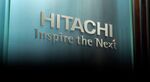 The Hitachi Ltd. logo is displayed on a glass wall in a reception area at the company's headquarters in Tokyo, Japan, on Thursday, Jan. 17, 2019.