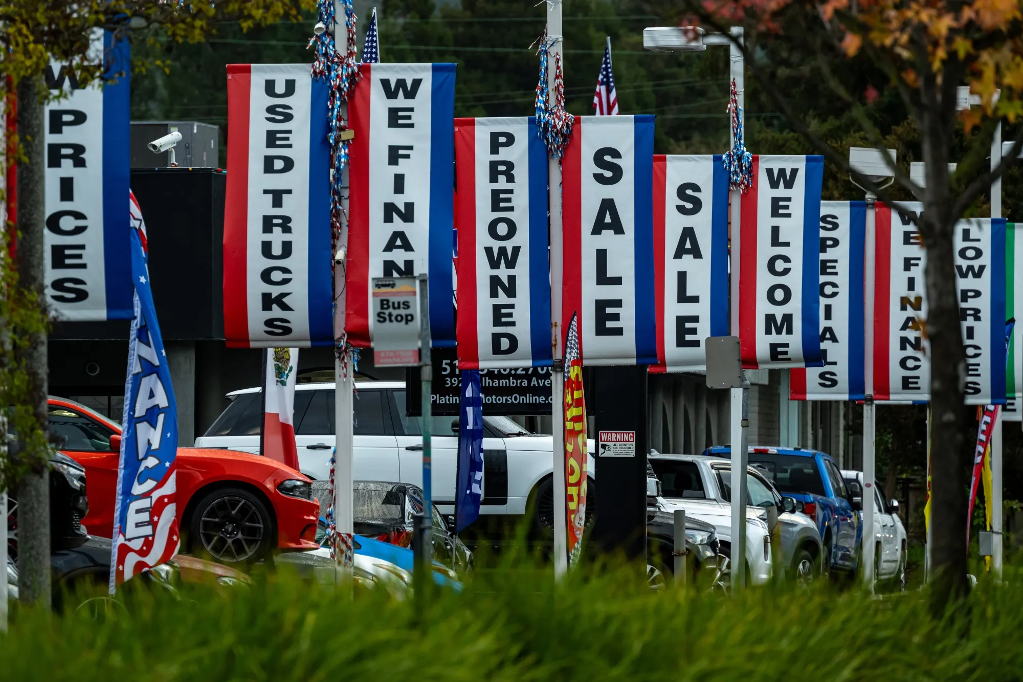 Used cars at a dealership in Martinez, California, US, on Monday, Nov. 17, 2025. The record number of Americans falling behind on car payments is stoking concerns that more pain is in store for subprime auto lenders.