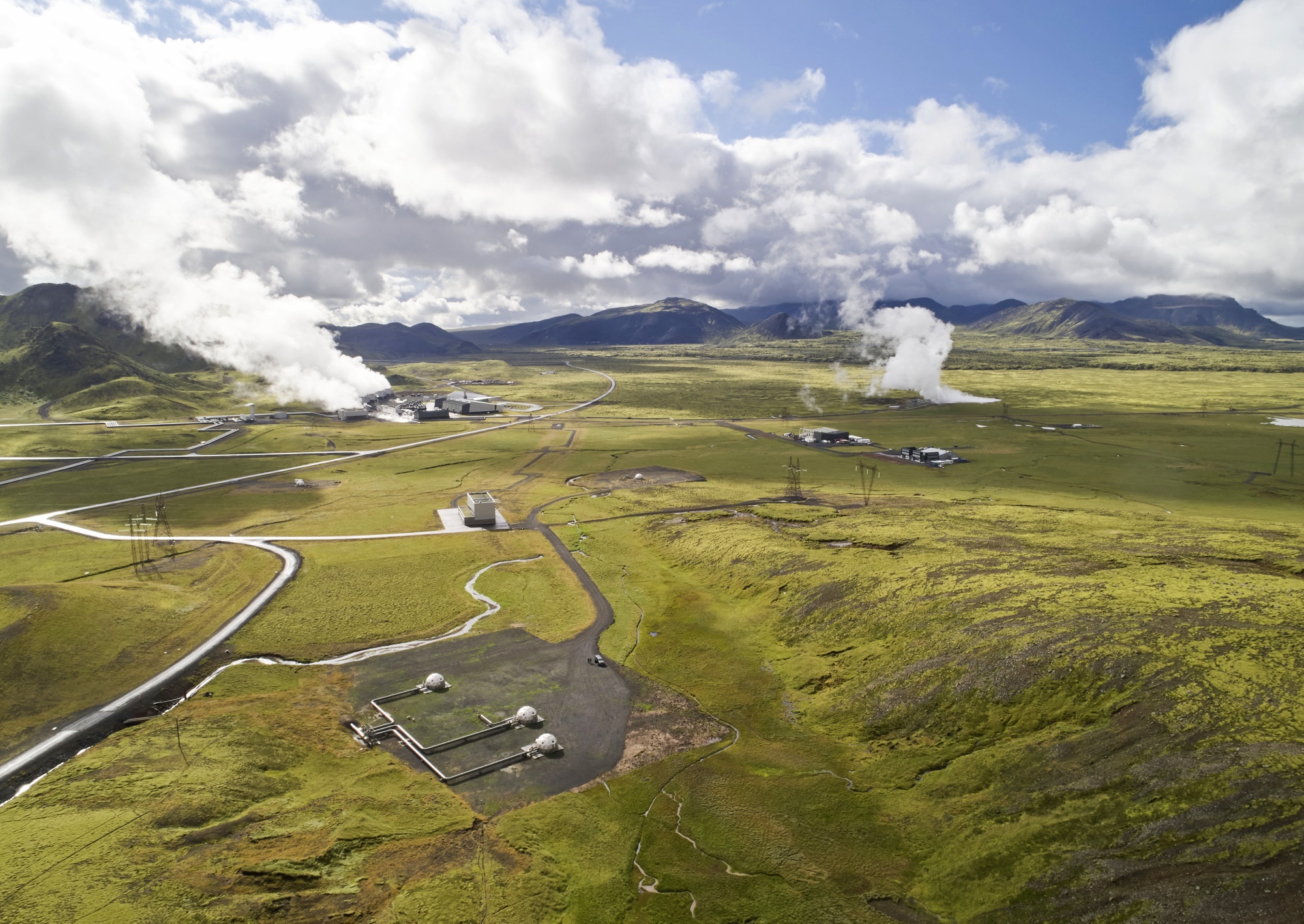 The world's largest direct-air capture facility, Orca, right, at the Hellisheidi geothermal power site, in Iceland.