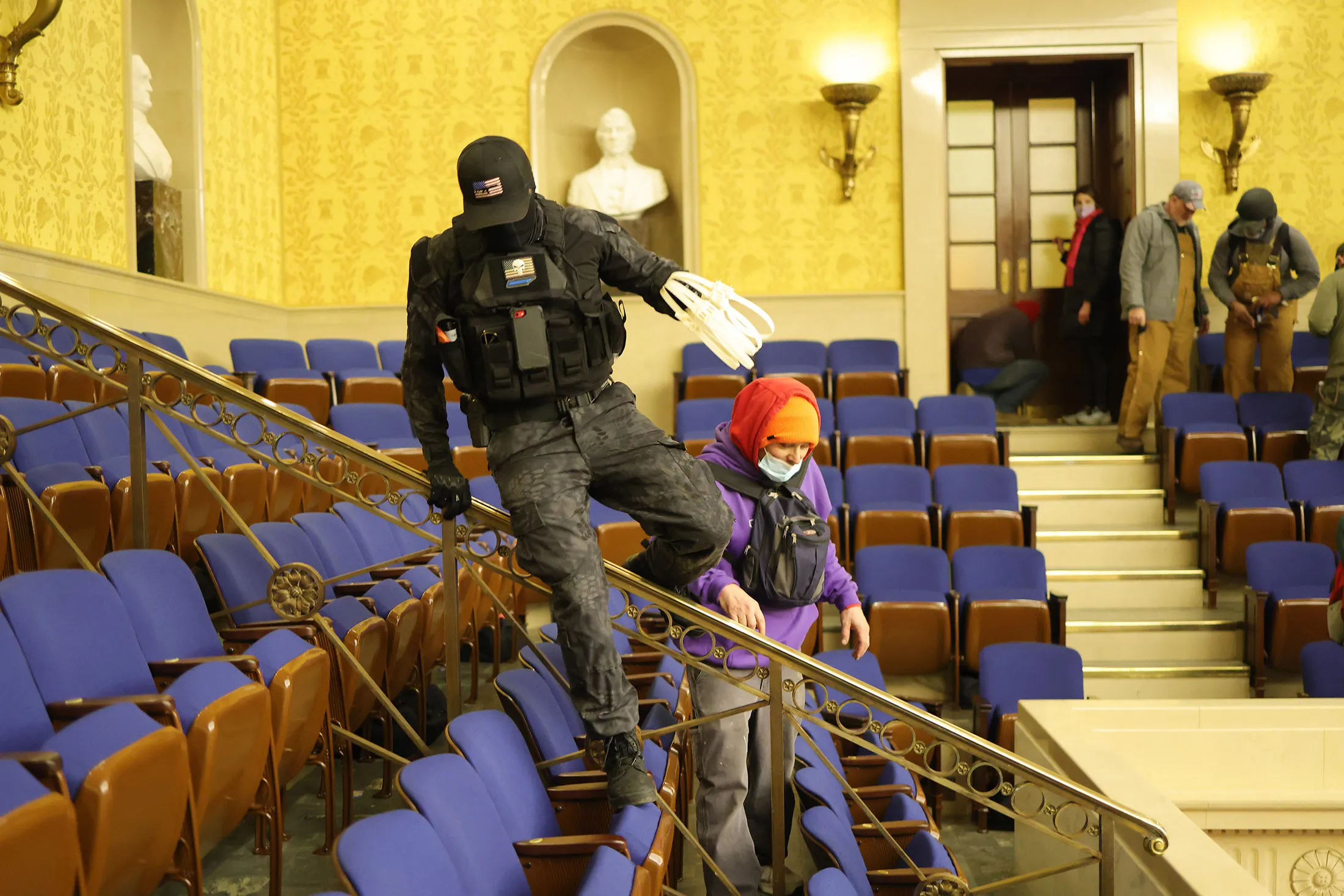 Protesters enter the Senate Chamber of the Capitol.