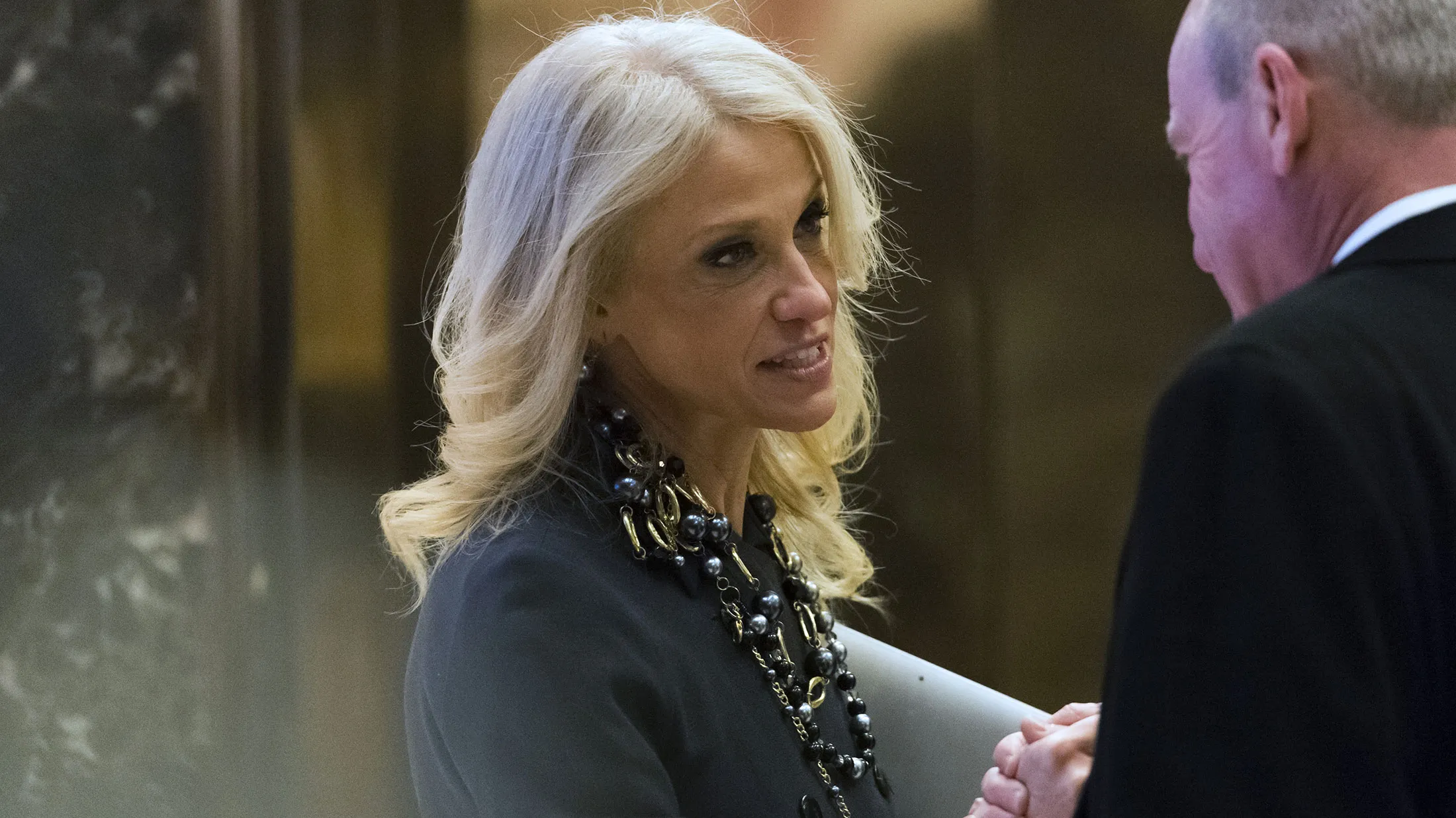 Kellyanne Conway, senior adviser to President-elect Donald Trump, speaks to a visitor in the lobby of Trump Tower in New York on Dec. 15, 2016.
