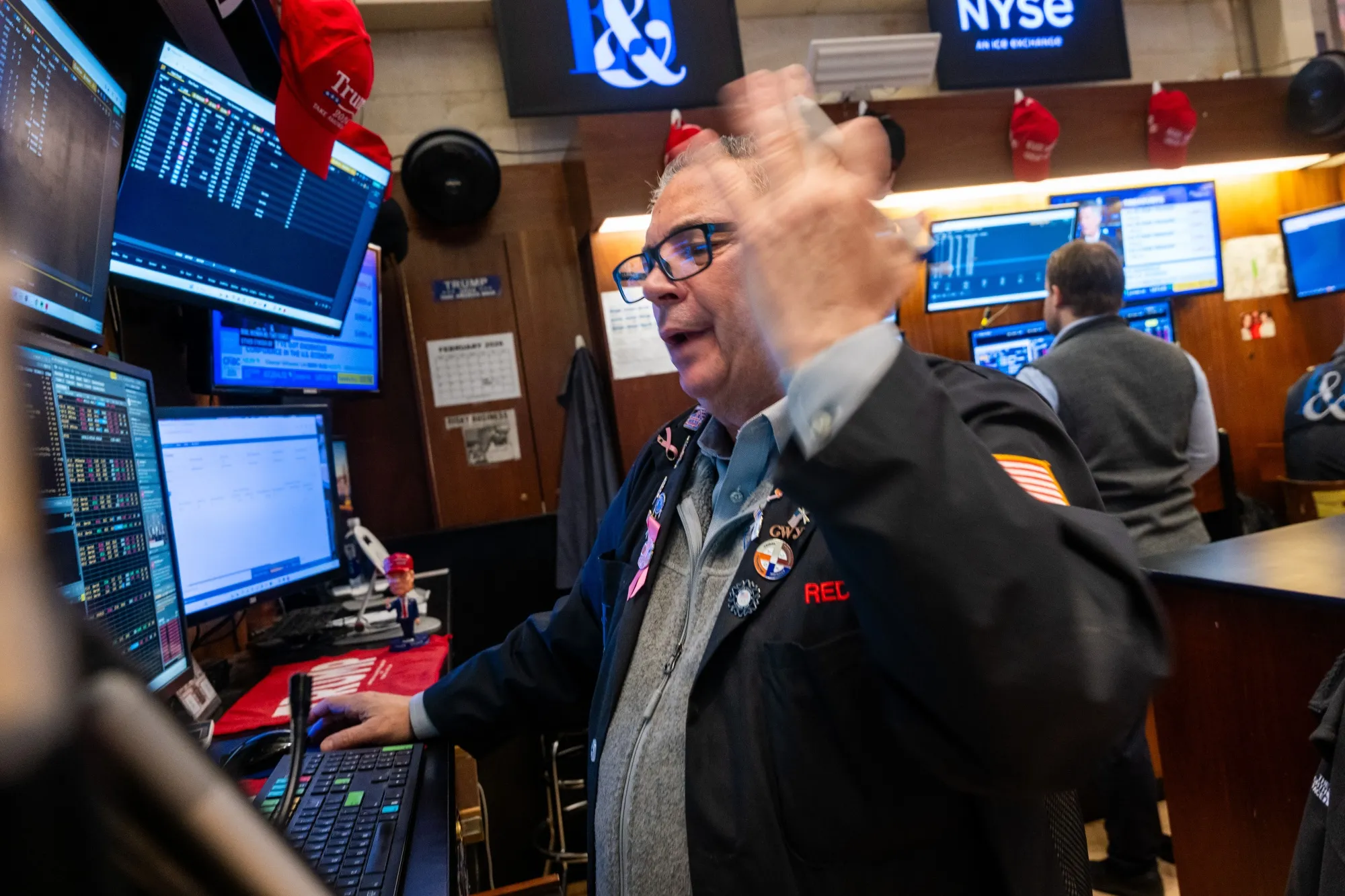 Traders work on the floor of the NYSE in New York on Feb. 13. Markets were down after a steep drop on Thursday, as investors continue to worry about AI’s impact on the broader economy.