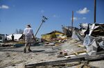 A resident surveys damage following Hurricane Ian in Matlacha Isles, Florida,&nbsp;on&nbsp;Oct. 1.