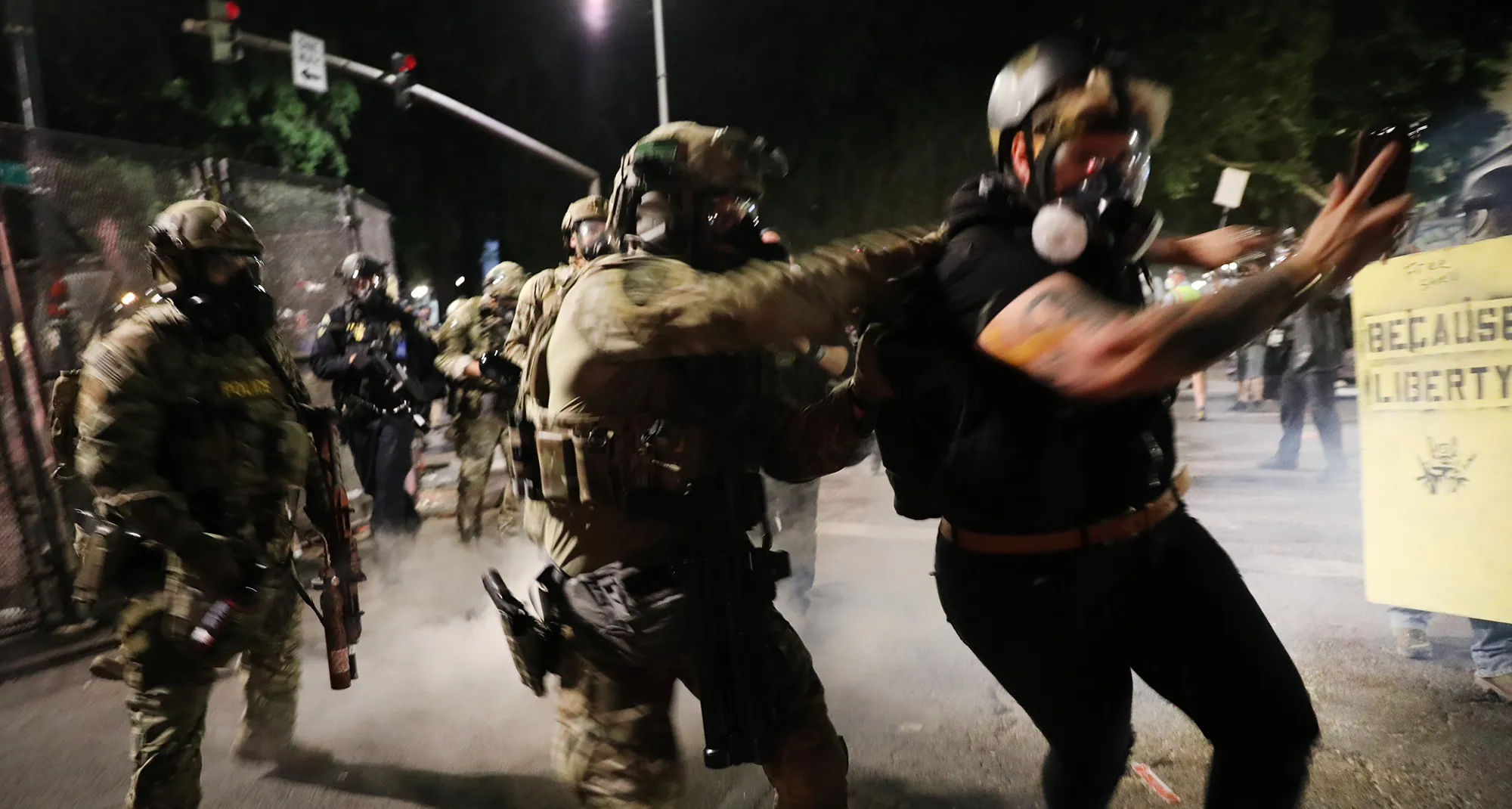 Federal police confront protesters in Portland on July 26.