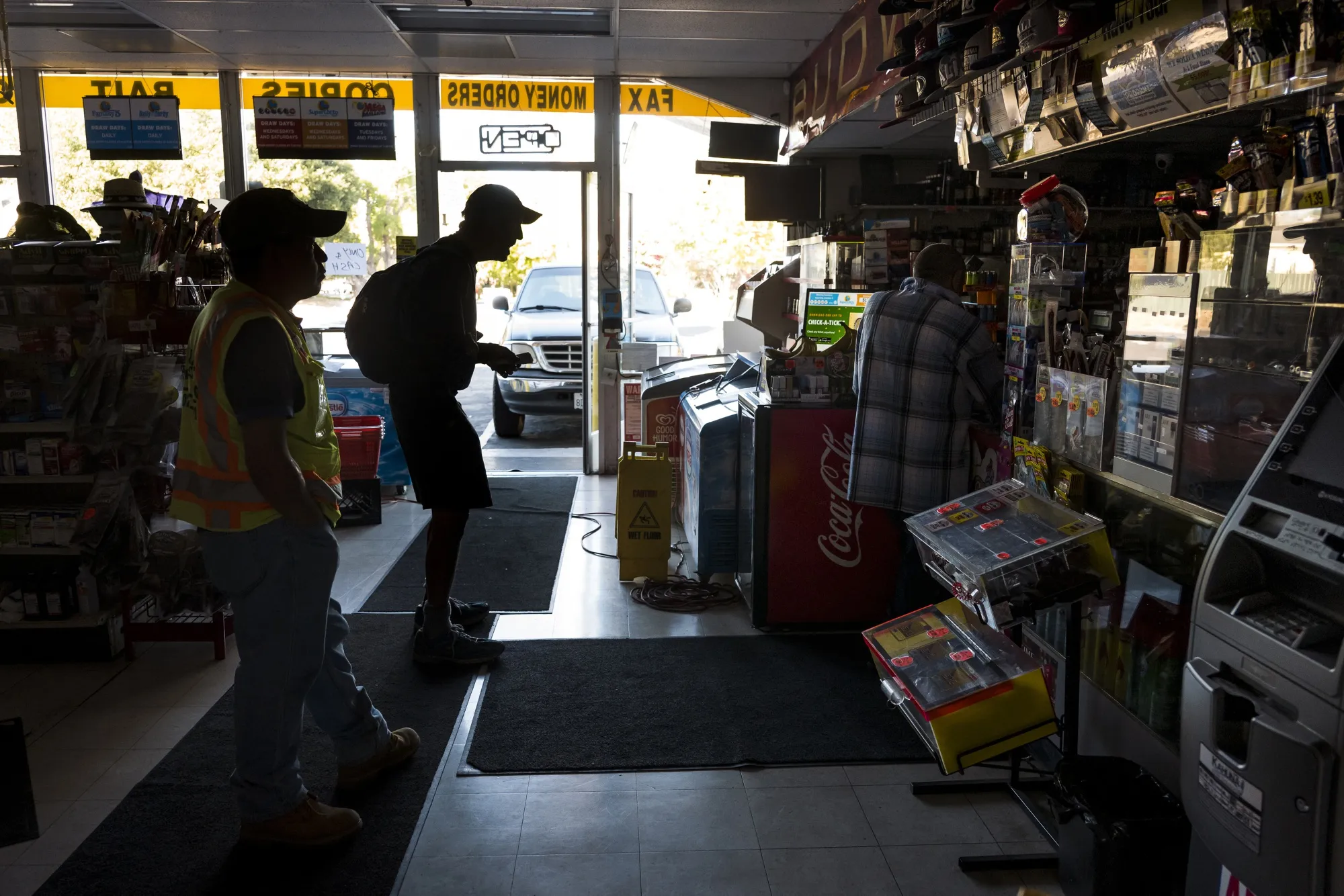 Customers shop at a store during a blackout in Napa, California, Oct. 9.